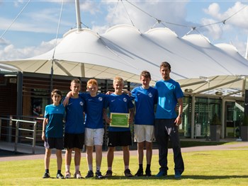 Tennis Boys Fly the Shrewsbury Club Flag